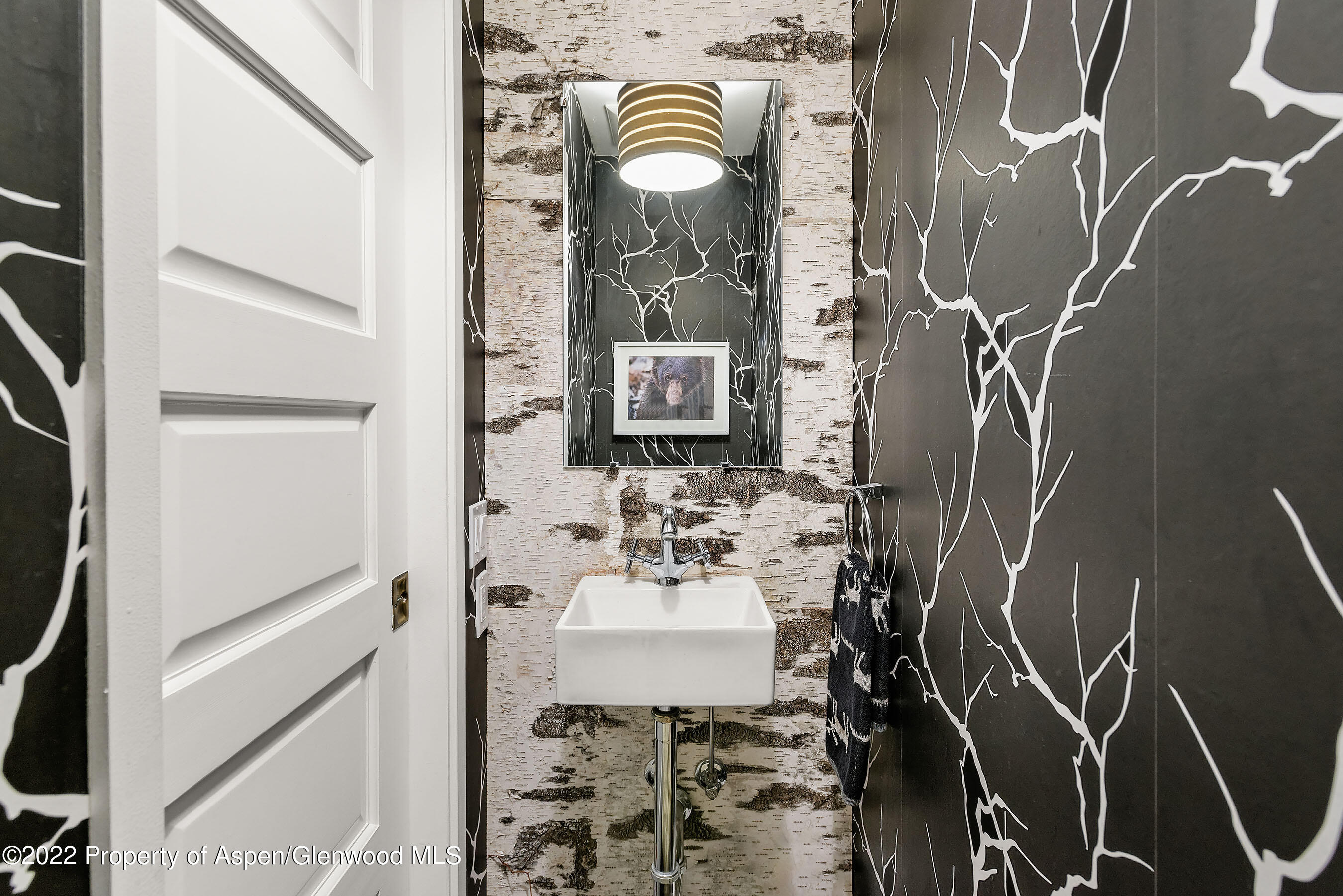 122 Eastwood Road Aspen, CO 81611 - Photo 7 of 22 a bathroom with a sink and mirror with bathtub