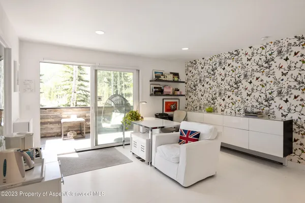 a living room with furniture and a gate