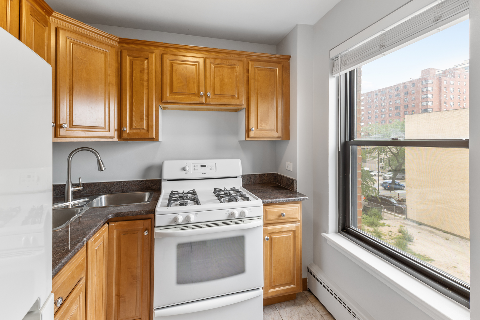 5858 North Sheridan Road, Unit 806 Chicago, IL 60660 - Photo 5 of 13 a kitchen with a stove and a microwave