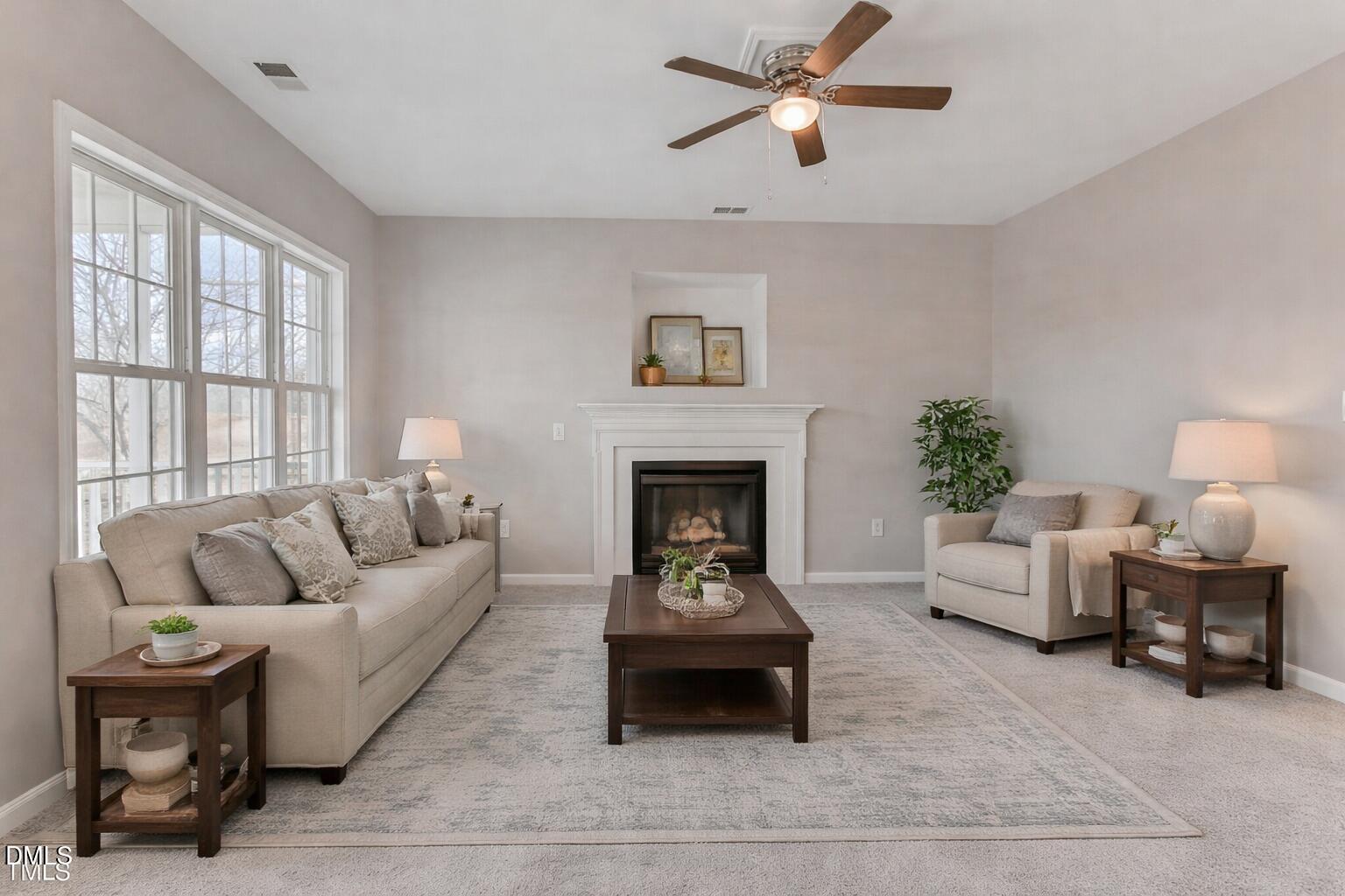 480 Seastone Street Raleigh, NC 27603 - Photo 3 of 26 a living room with furniture and a fireplace