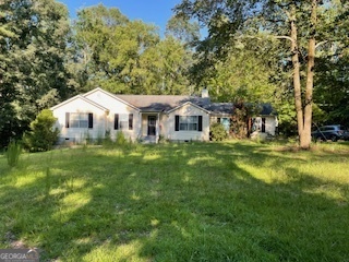 384 North Rover Road Williamson, GA 30292 - Photo 1 of 1 a house view with a garden space