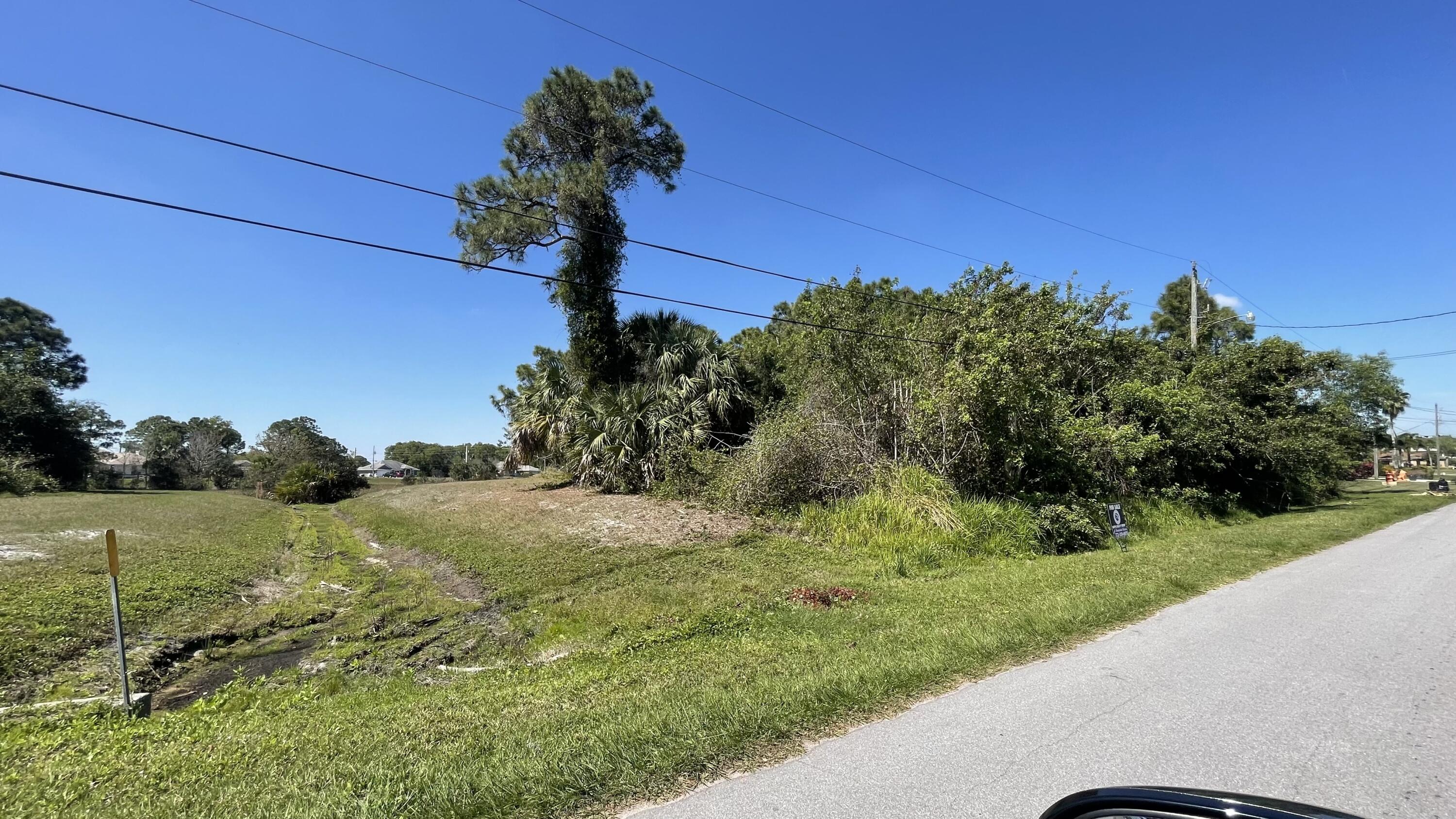 5103 Northwest Rugby Drive Port St. Lucie, FL 34983 - Photo 1 of 4 a view of a yard with a house
