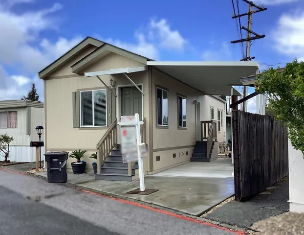 a front view of a house with a garage