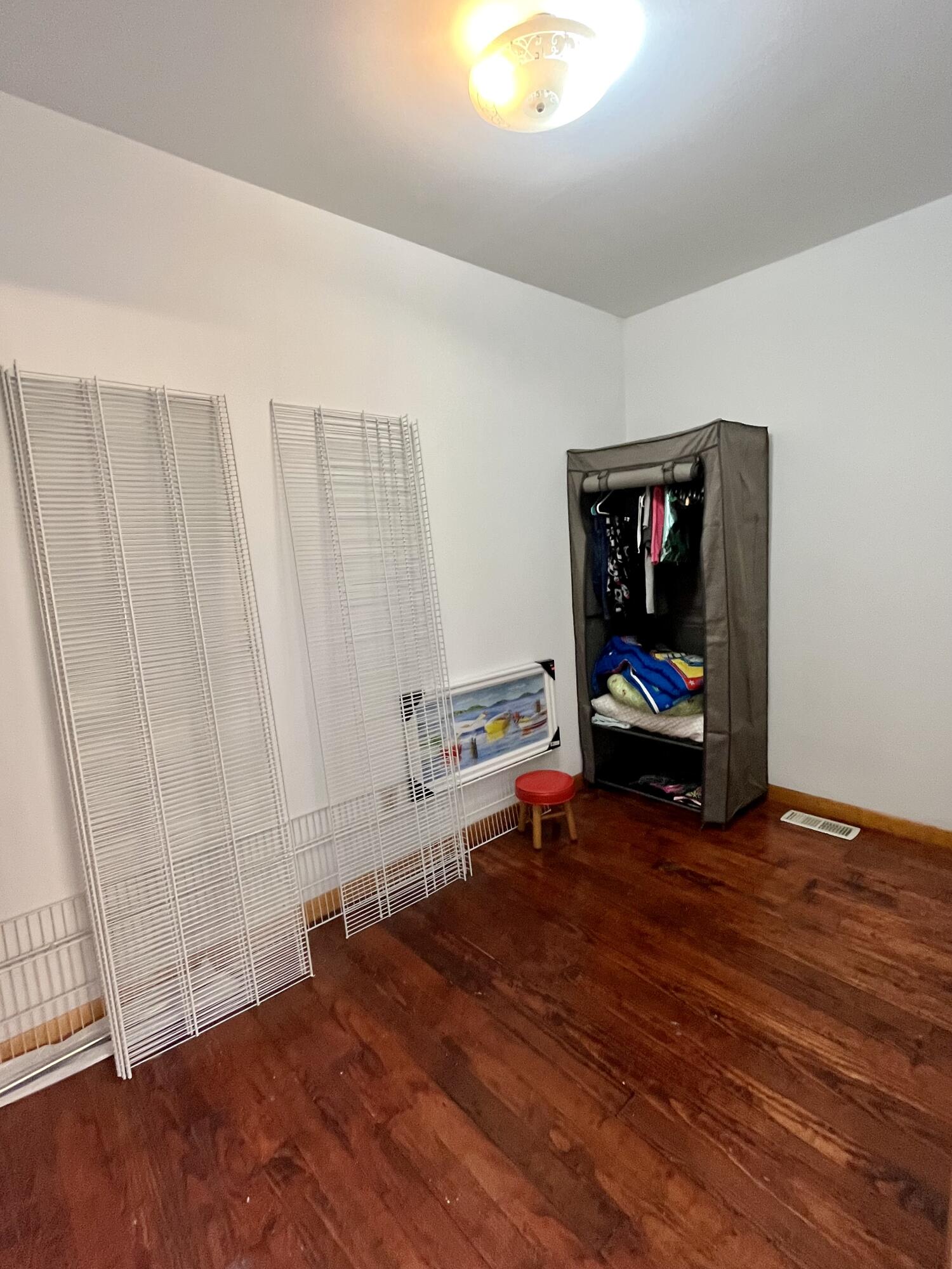 6270 East Donald Road Knox, IN 46534 - Photo 19 of 26 a view of empty room with wooden floor and fan
