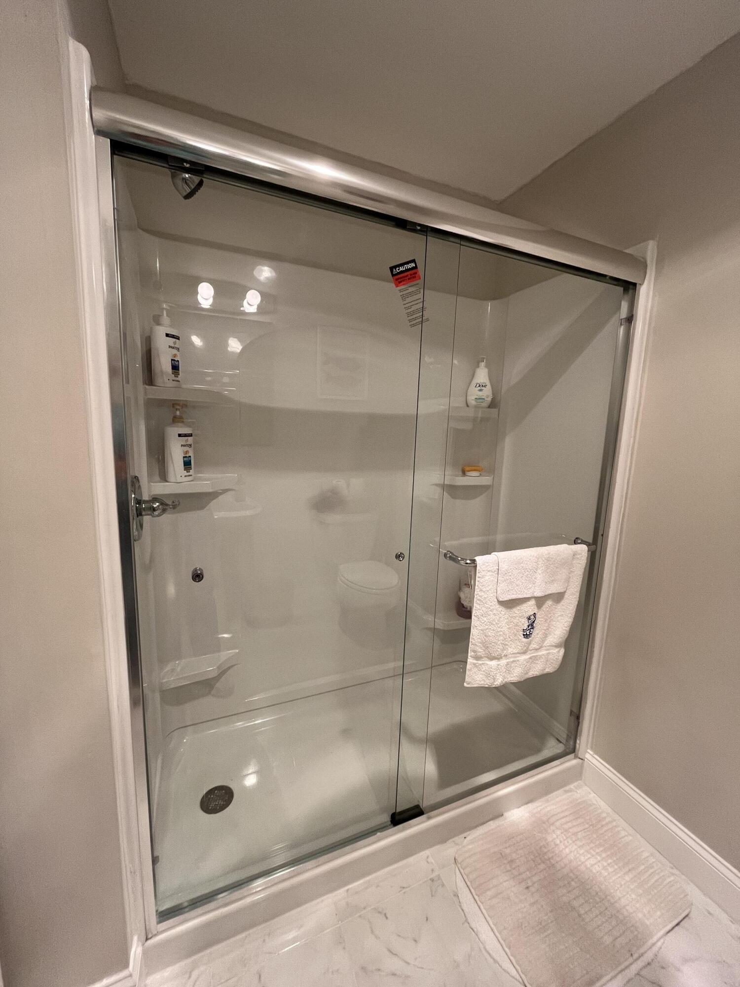 6270 East Donald Road Knox, IN 46534 - Photo 22 of 26 a bathroom with a glass shower door