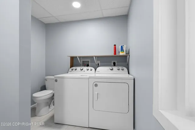 a utility room with dryer and washer