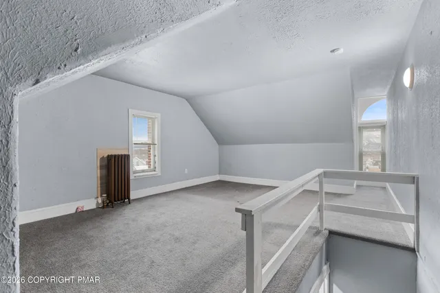 a view of a livingroom with an empty space and window