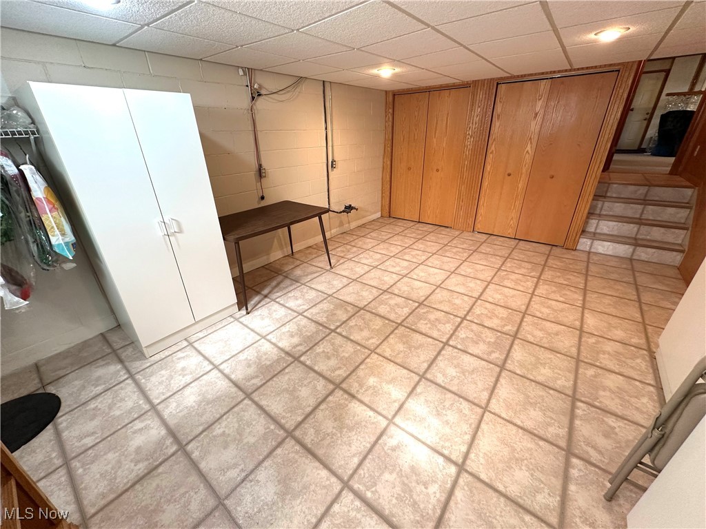 1684 Morris Street Mineral Ridge, OH 44440 - Photo 47 of 50 Finished below grade area featuring concrete block wall and a drop ceiling