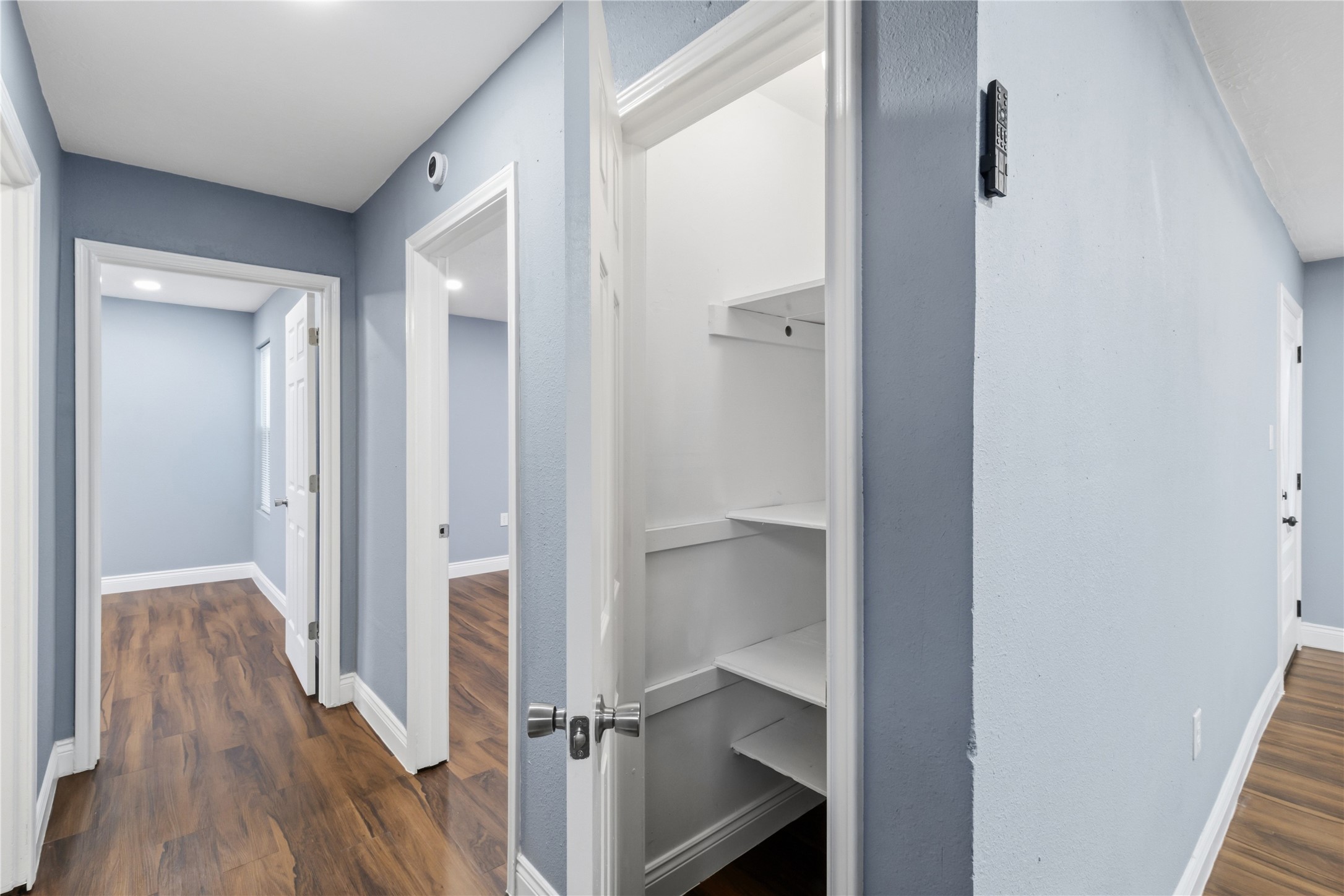 901 South 7th Street Baytown, TX 77520 - Photo 19 of 36 a view of a hallway with wooden floor and closet
