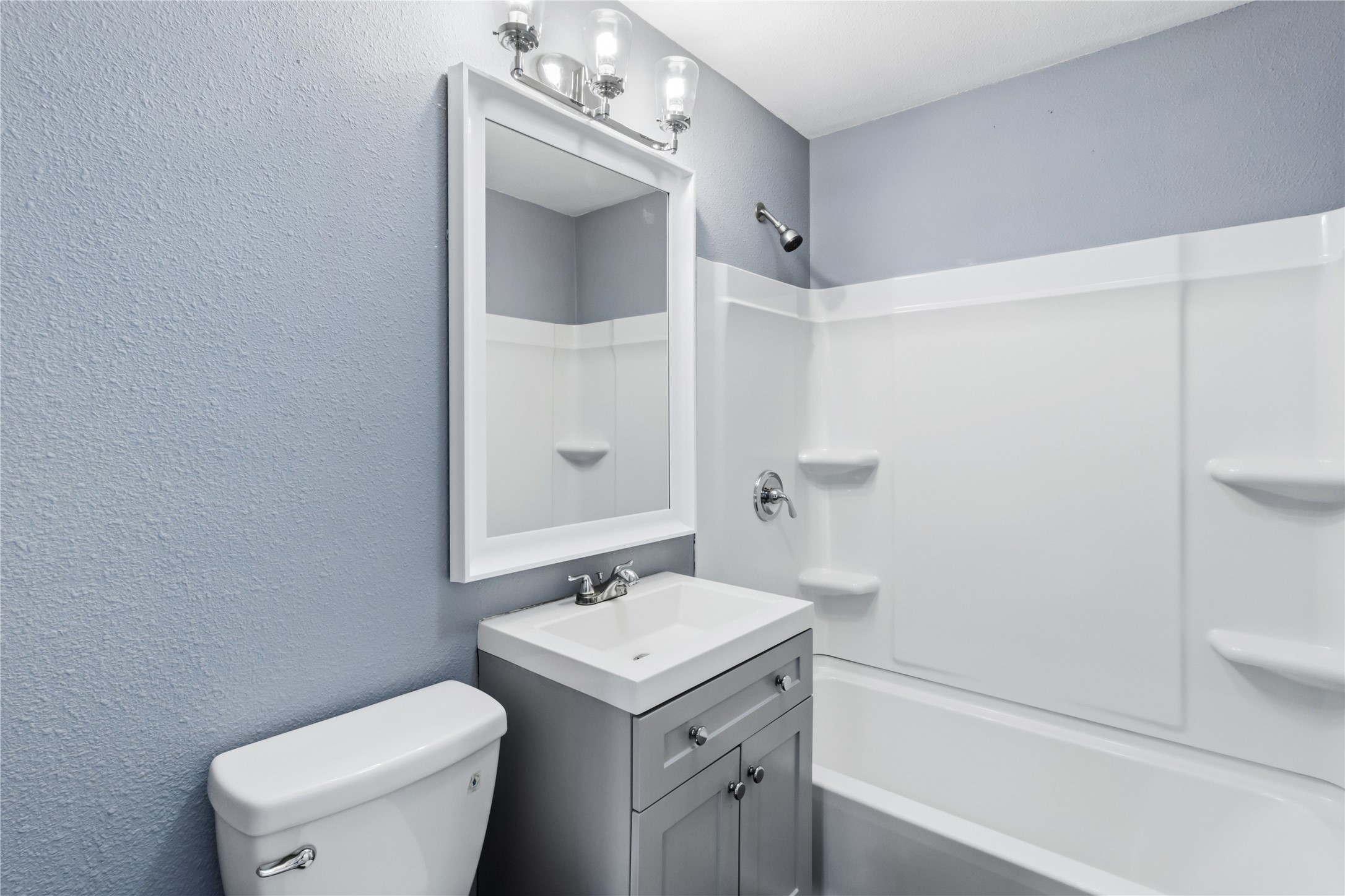 901 South 7th Street Baytown, TX 77520 - Photo 20 of 36 a bathroom with a toilet sink and mirror