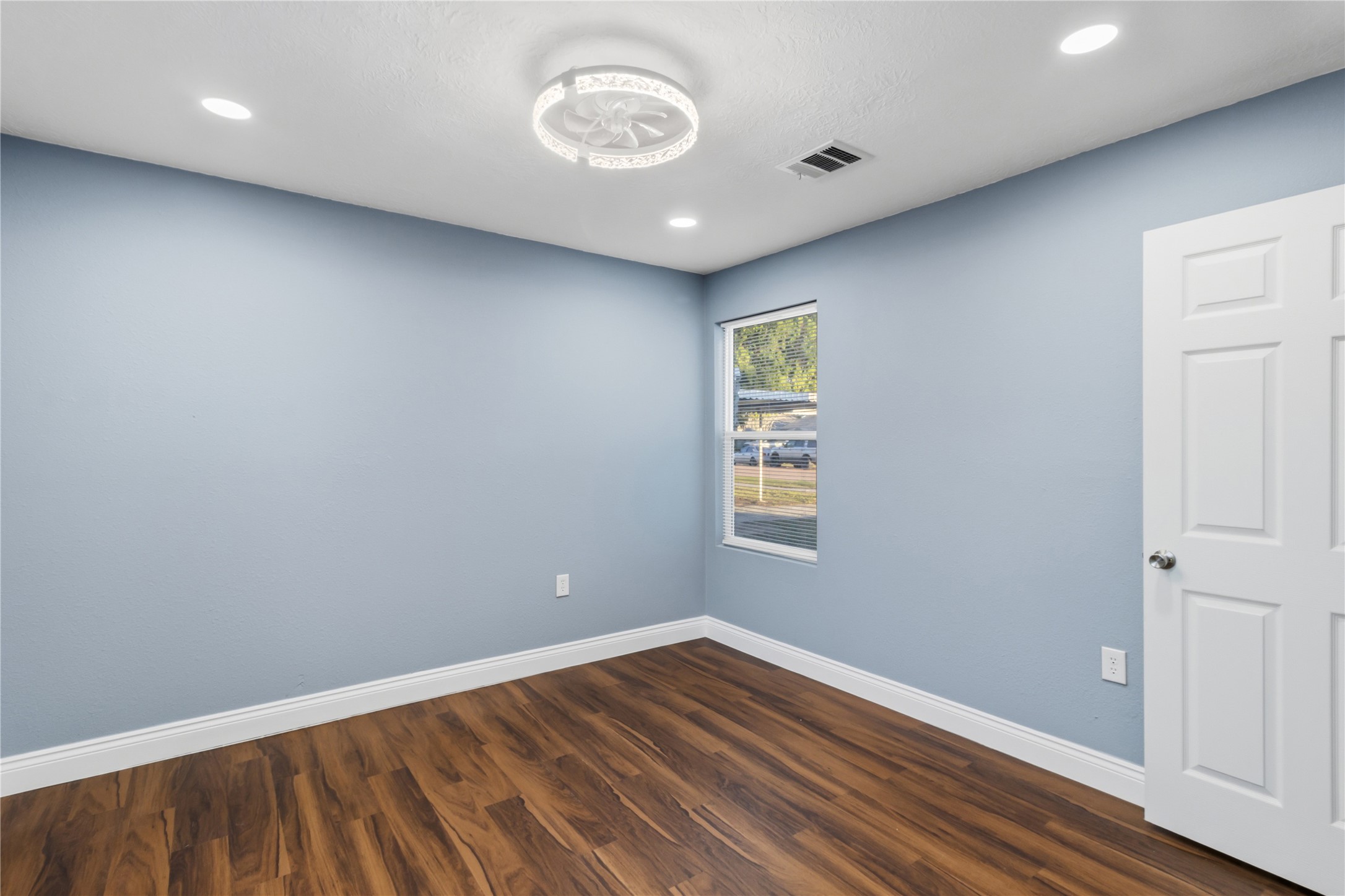 901 South 7th Street Baytown, TX 77520 - Photo 22 of 36 a view of empty room with wooden floor
