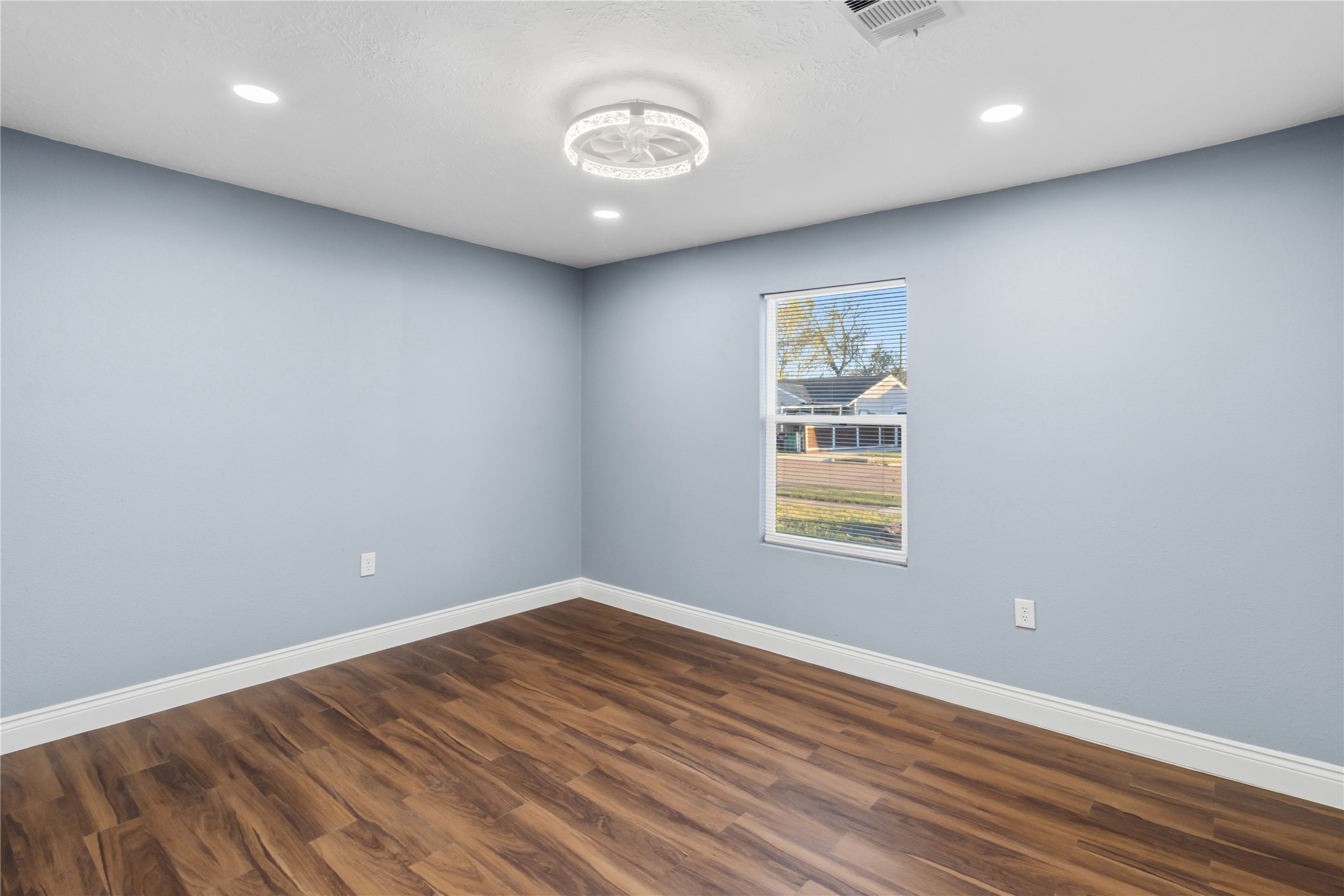 901 South 7th Street Baytown, TX 77520 - Photo 24 of 36 a view of an empty room with wooden floor and a window