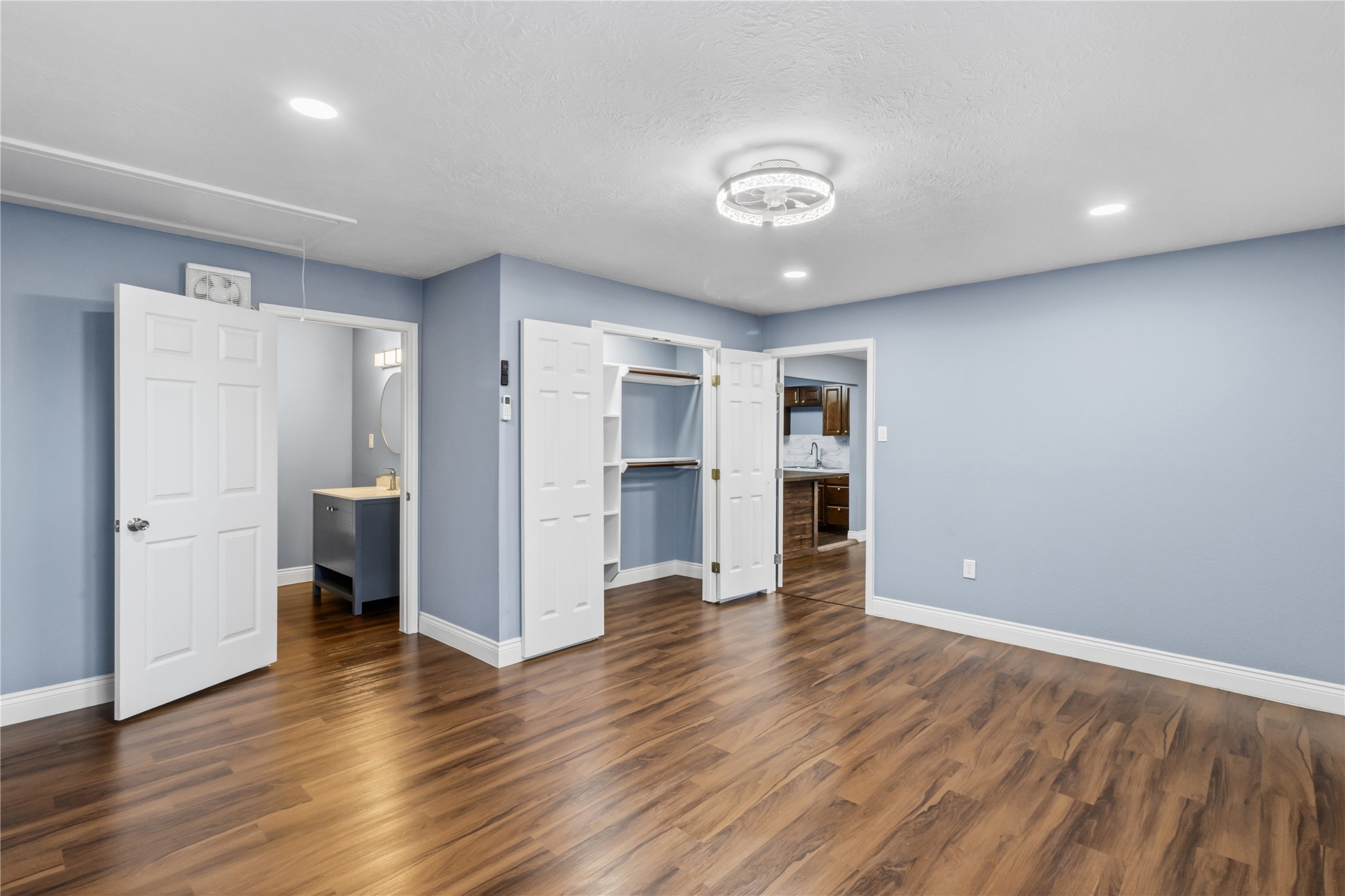 901 South 7th Street Baytown, TX 77520 - Photo 25 of 36 a view of an empty room with wooden floor and a cabinet