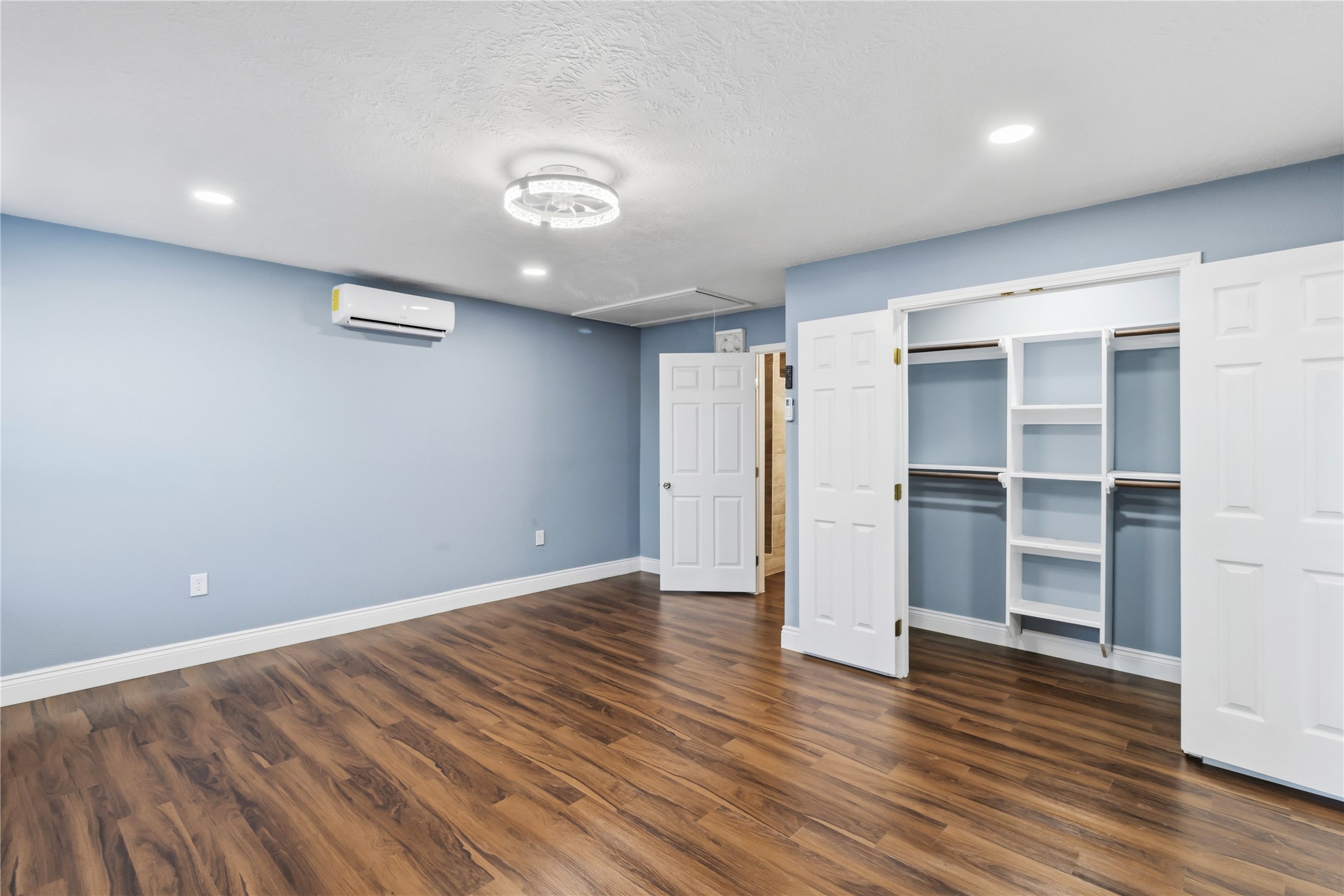 901 South 7th Street Baytown, TX 77520 - Photo 26 of 36 a view of an empty room with wooden floor and closet