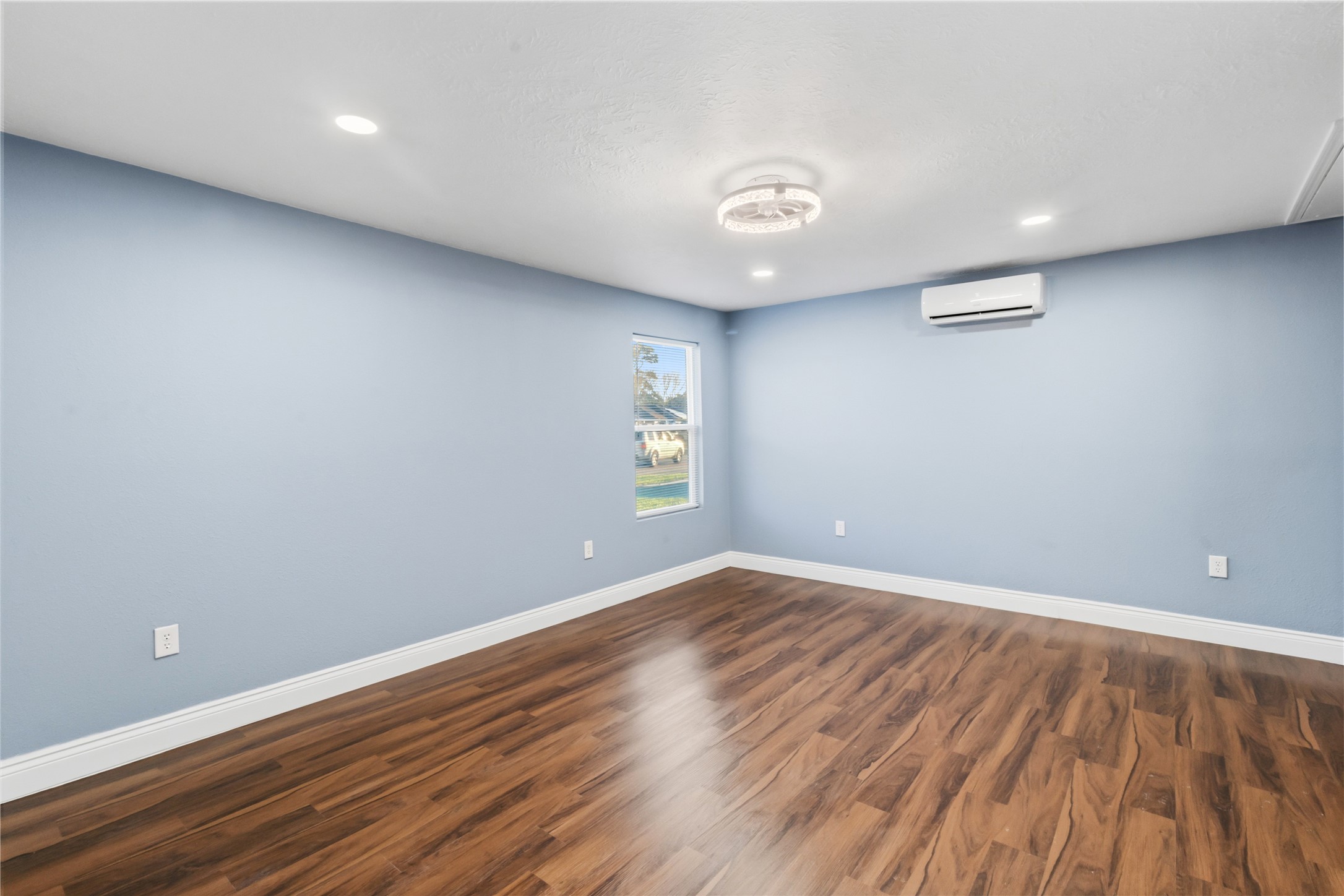 901 South 7th Street Baytown, TX 77520 - Photo 27 of 36 an empty room with wooden floor and windows