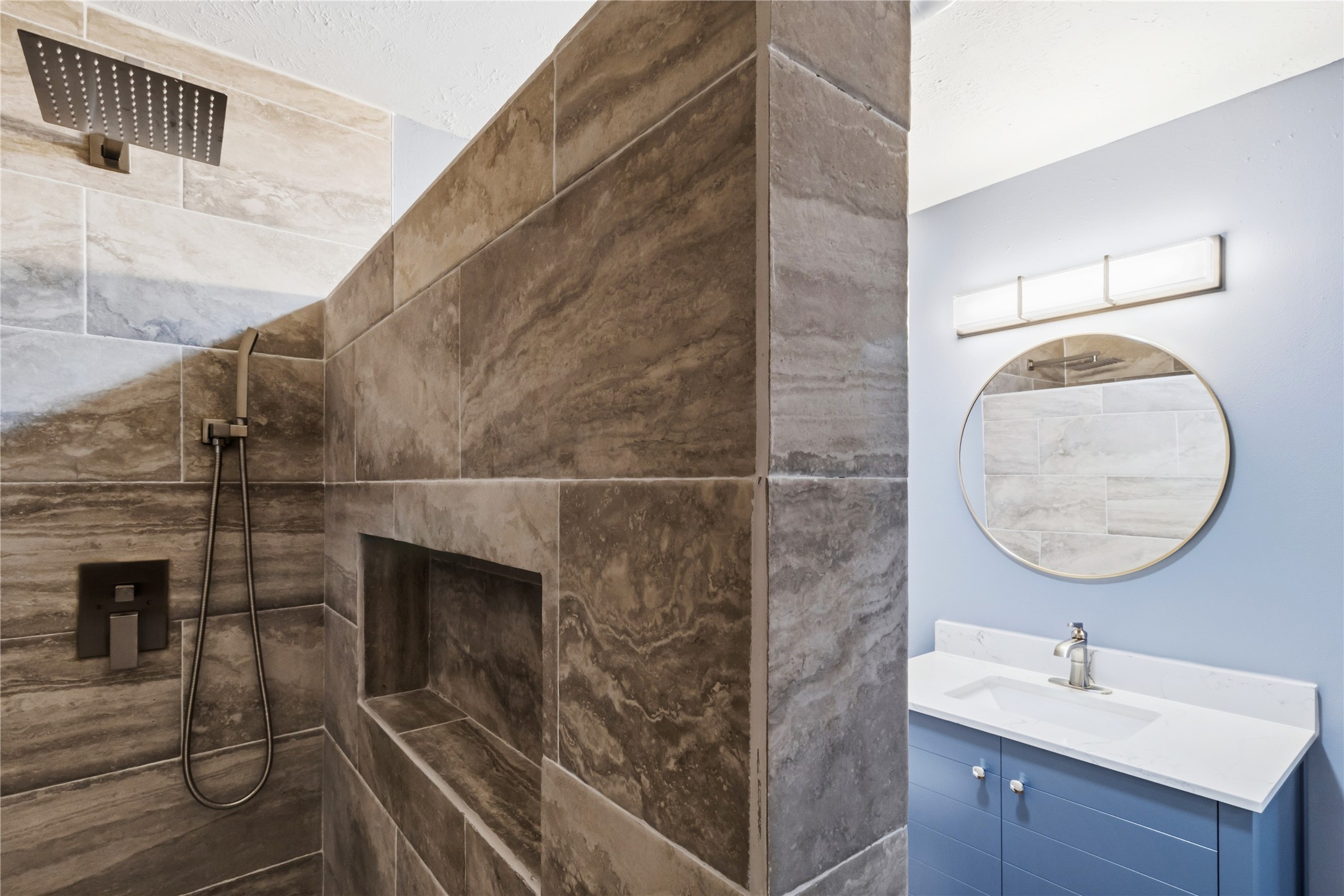 901 South 7th Street Baytown, TX 77520 - Photo 30 of 36 a bathroom with a sink a mirror and shower