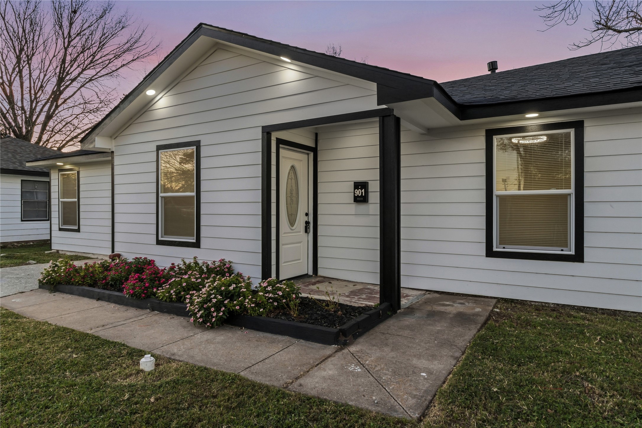 901 South 7th Street Baytown, TX 77520 - Photo 3 of 36 a front view of a house with a yard