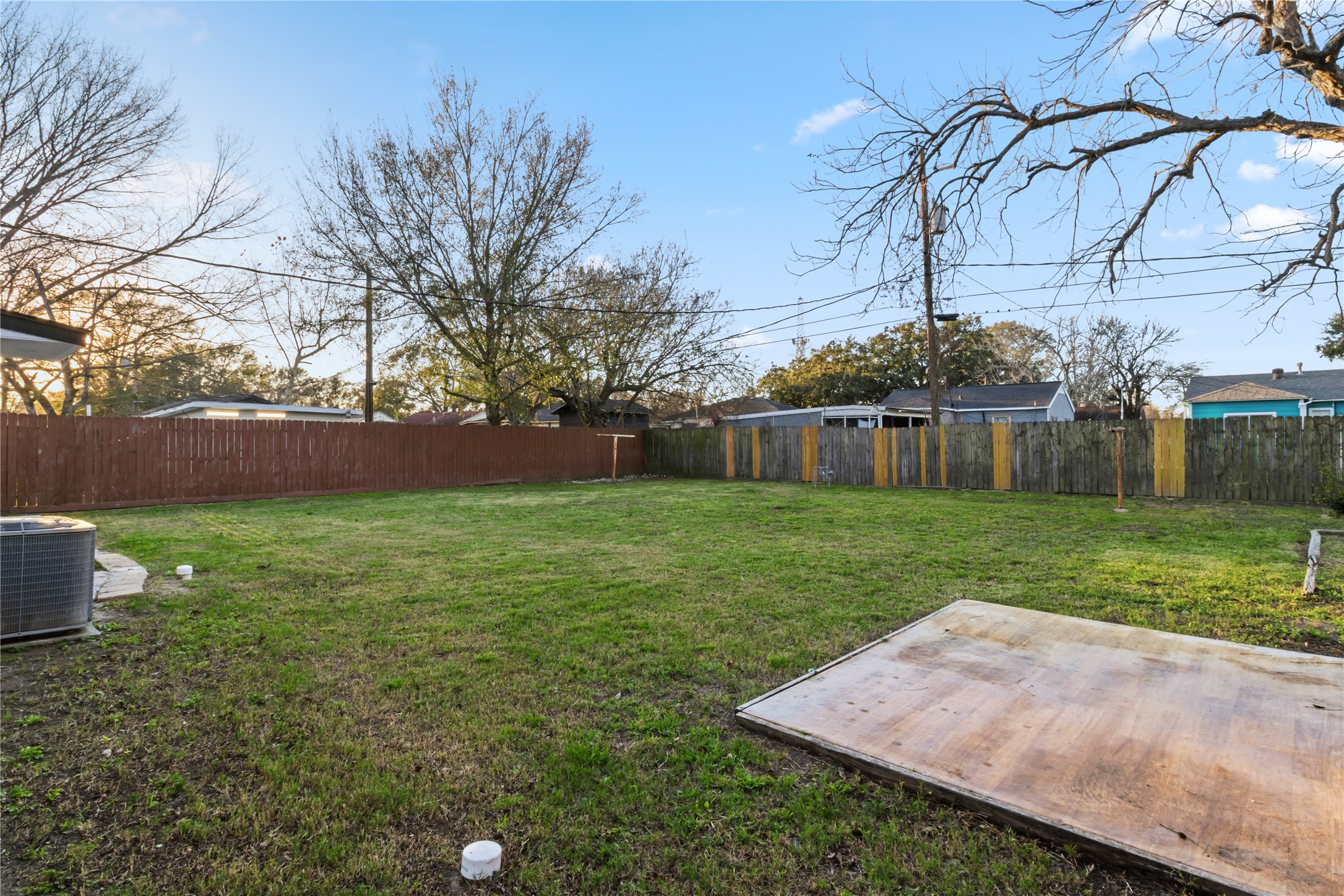 901 South 7th Street Baytown, TX 77520 - Photo 33 of 36 a view of a yard with an tree and a fence