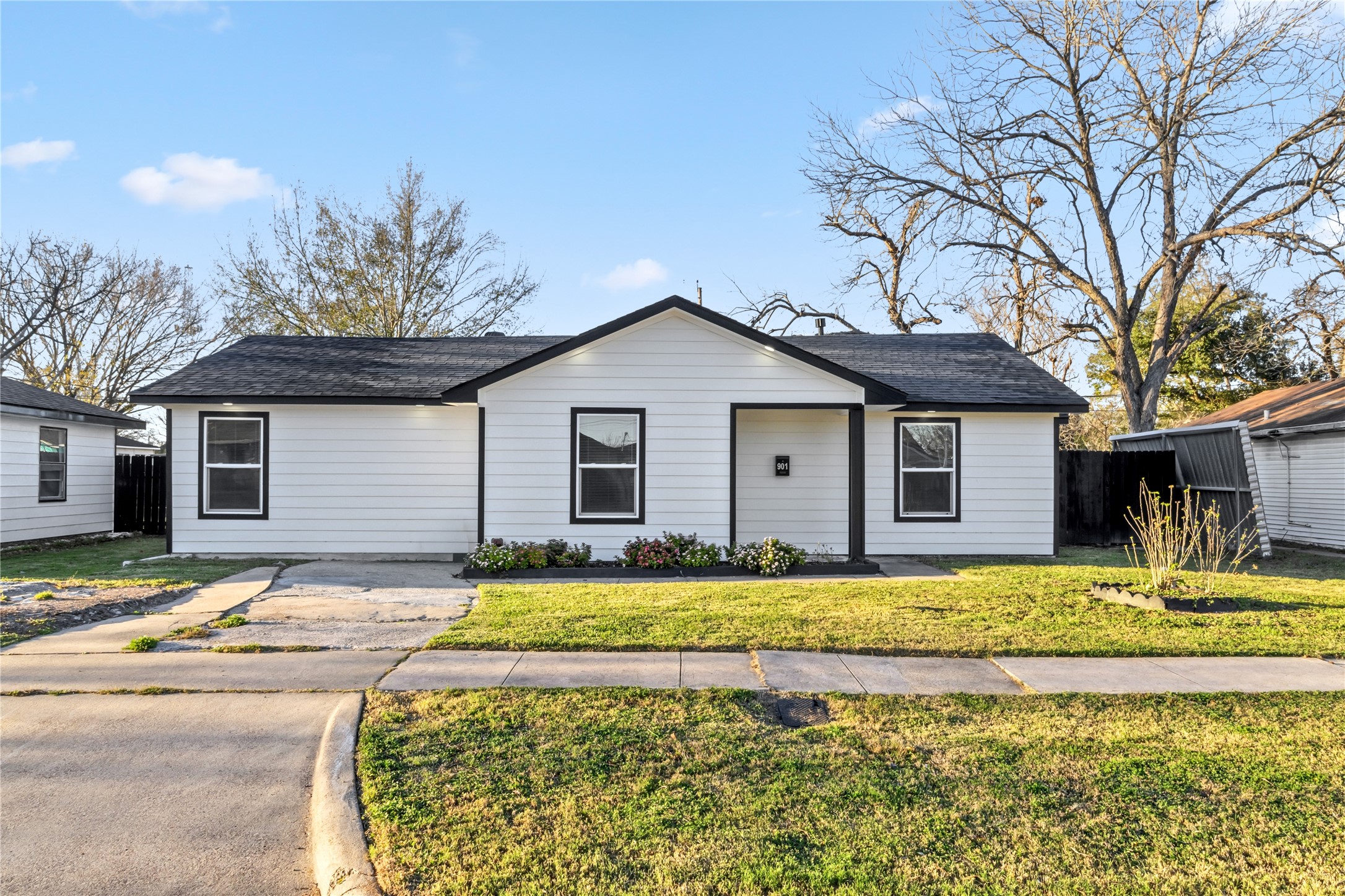 901 South 7th Street Baytown, TX 77520 - Photo 5 of 36 a view of a house with a swimming pool and a yard