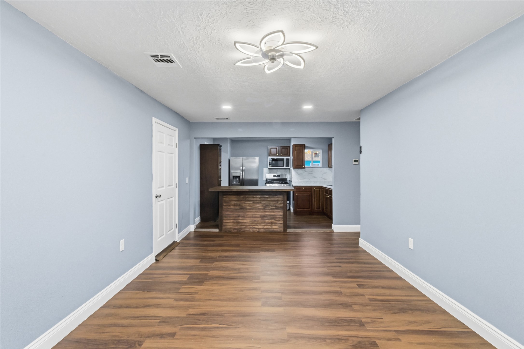 901 South 7th Street Baytown, TX 77520 - Photo 7 of 36 a view of kitchen with wooden floor