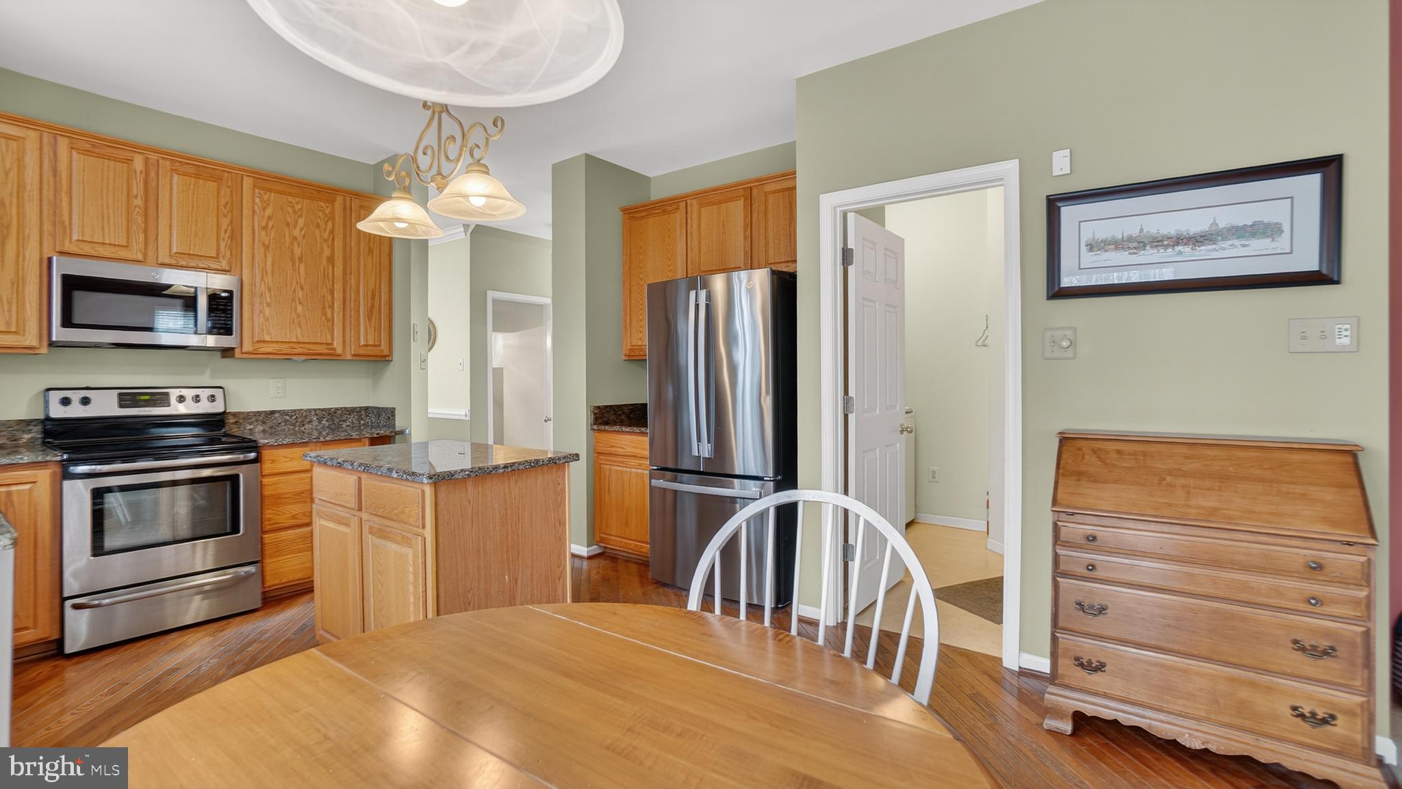 2806 Erna Court Crofton, MD 21054 - Photo 15 of 60 a kitchen with stainless steel appliances a stove a refrigerator and a microwave