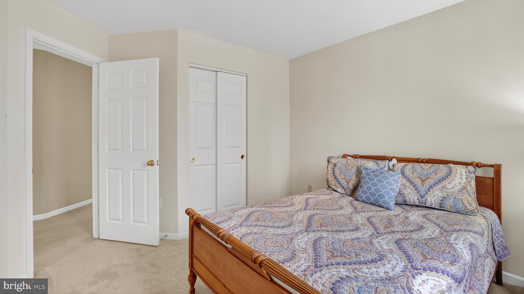 2806 Erna Court Crofton, MD 21054 - Photo 37 of 60 a bedroom with a bed and a night stand