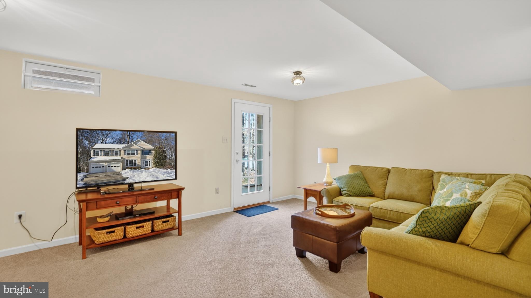 2806 Erna Court Crofton, MD 21054 - Photo 44 of 60 a living room with furniture and a couch