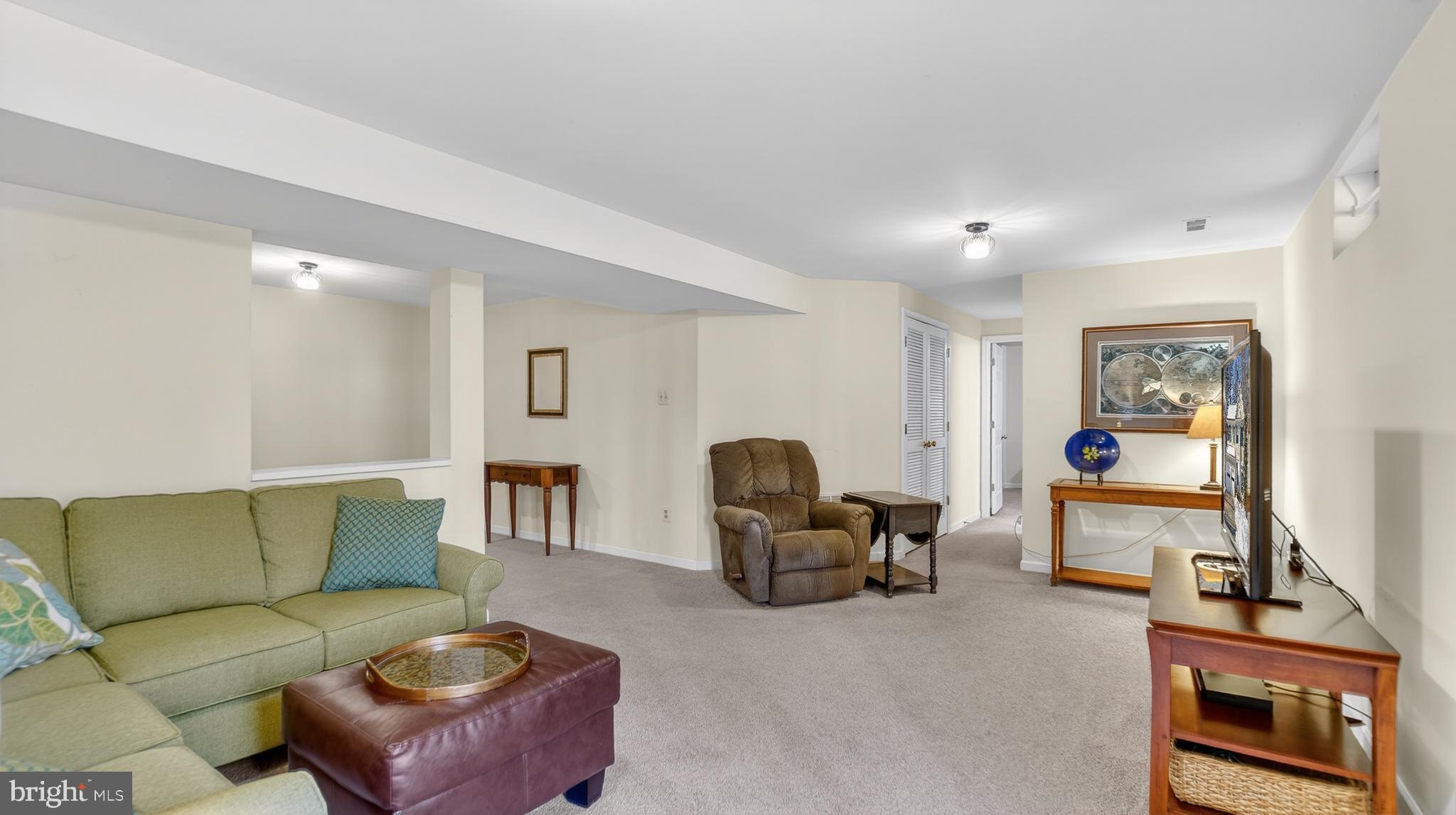 2806 Erna Court Crofton, MD 21054 - Photo 46 of 60 a living room with furniture and a flat screen tv