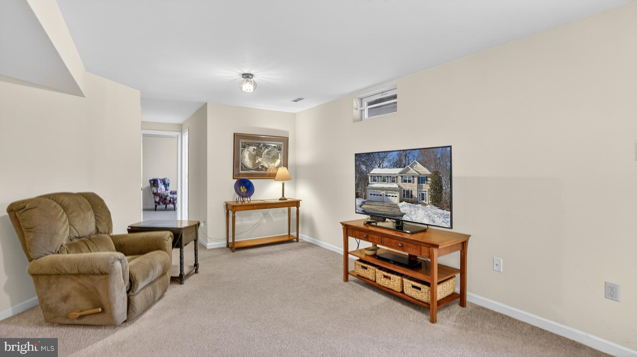 2806 Erna Court Crofton, MD 21054 - Photo 48 of 60 a bedroom with furniture and a chair