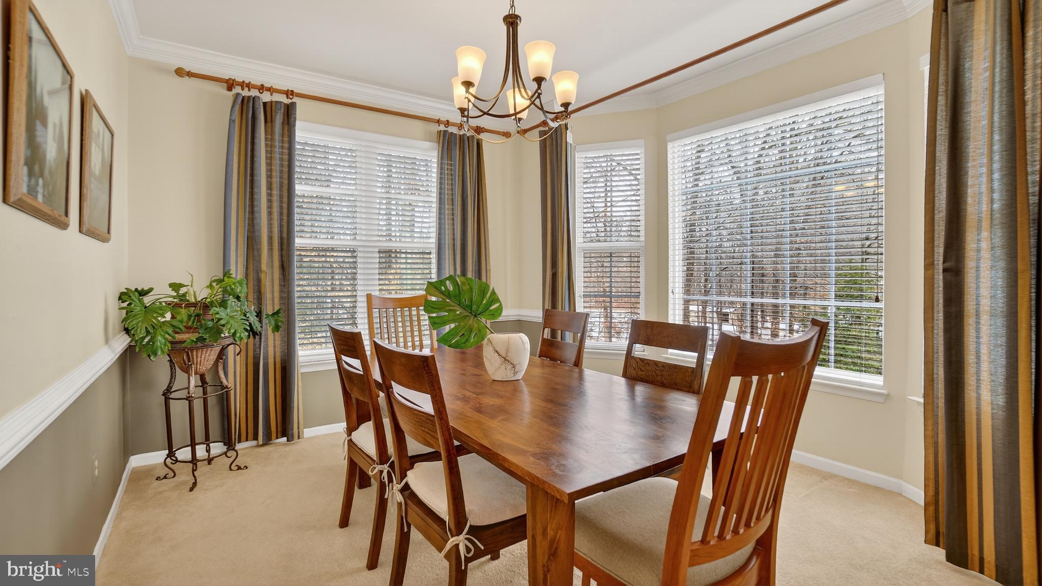 2806 Erna Court Crofton, MD 21054 - Photo 7 of 60 a view of a dining room with furniture window and wooden floor