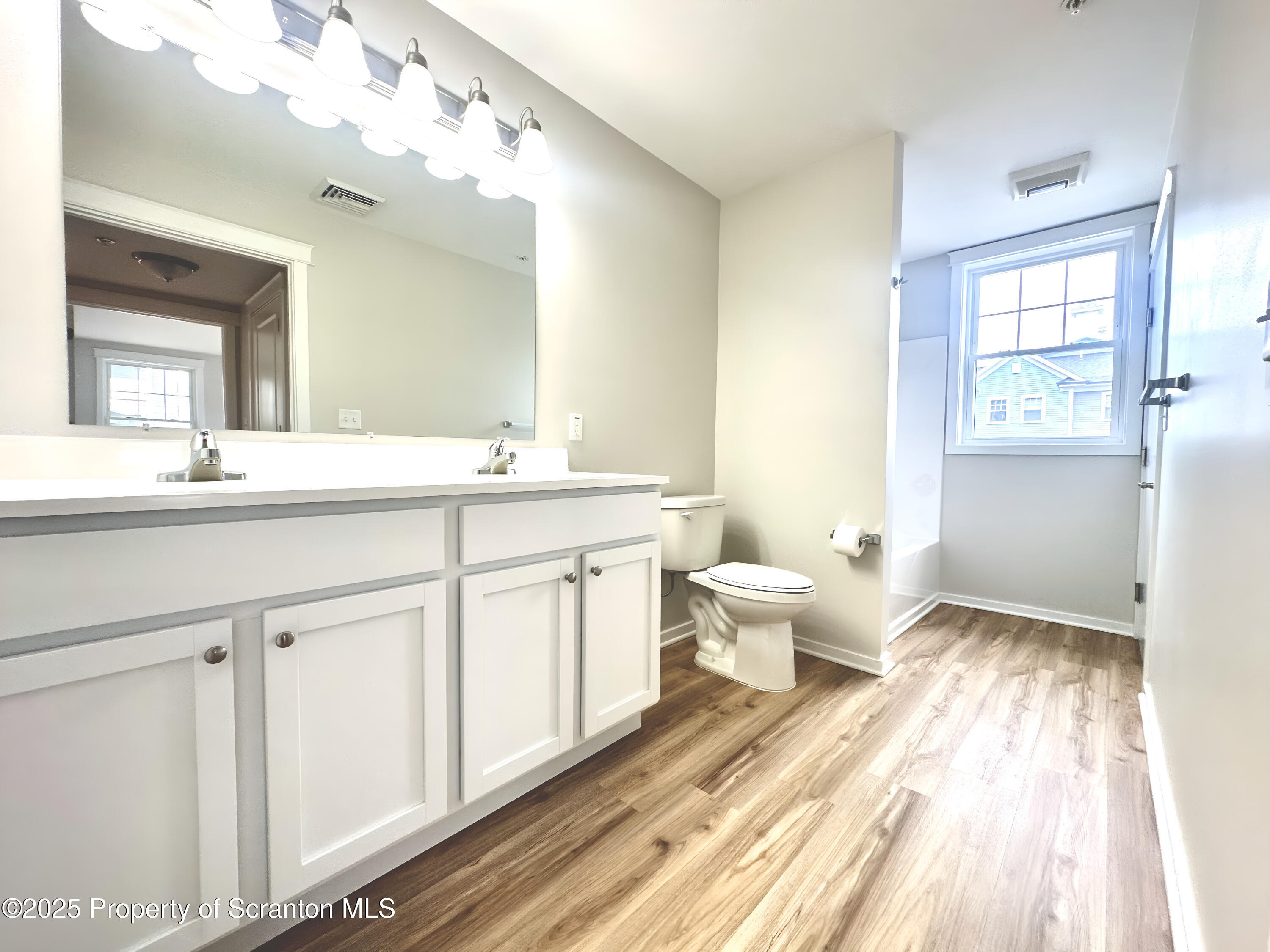88 Bianca Way Old Forge, PA 18518 - Photo 8 of 10 a spacious bathroom with a double vanity sink mirror and toilet