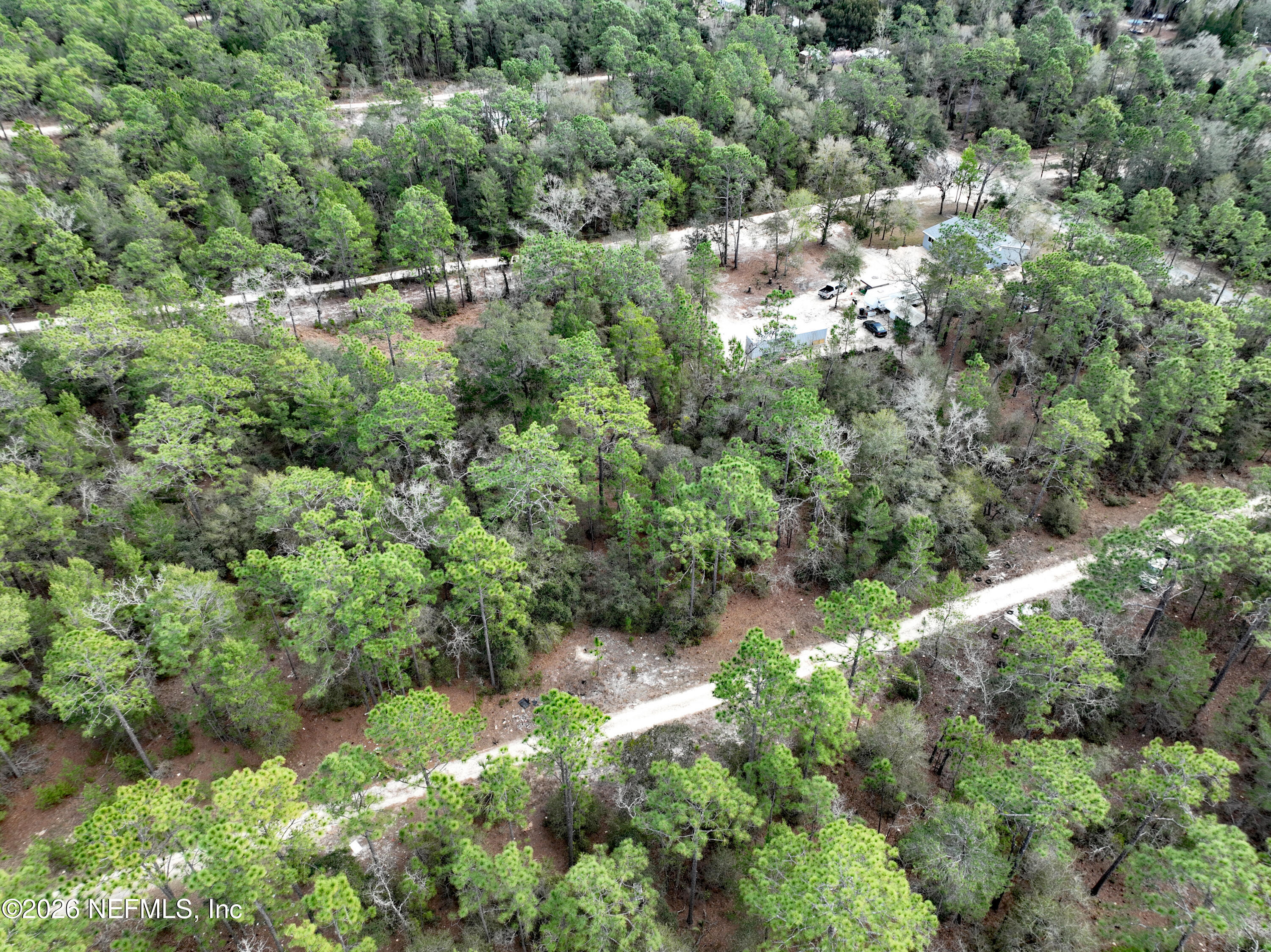 416 Mourning Dove Road Satsuma, FL 32189 - Photo 11 of 22 an aerial view of residential house with outdoor space and trees all around