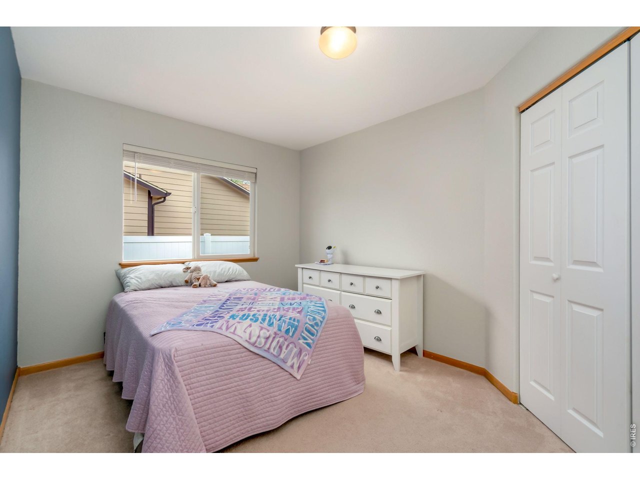 3779 Mount Meeker Street Wellington, CO 80549 - Photo 15 of 30 a bedroom with a bed and a window
