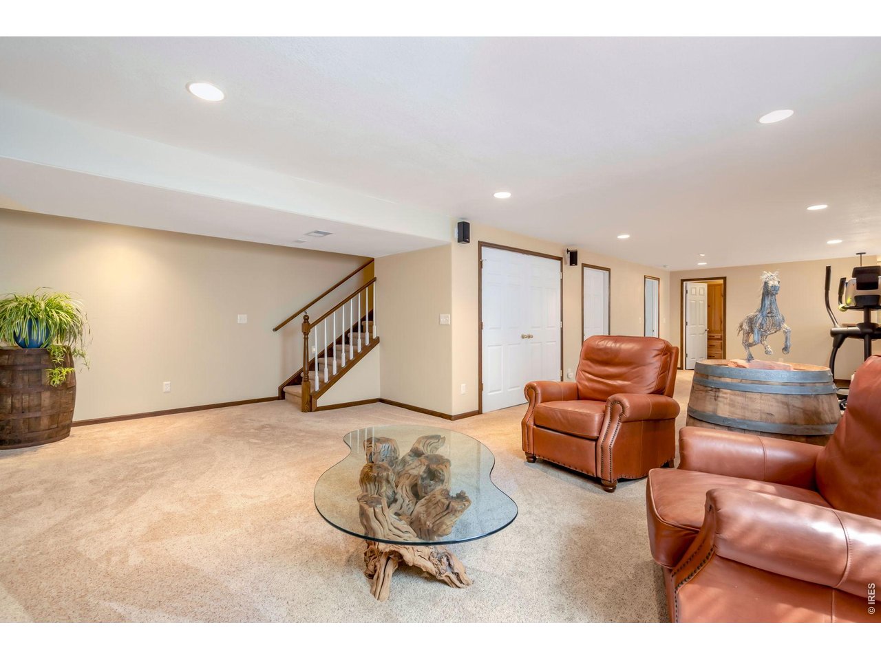 3779 Mount Meeker Street Wellington, CO 80549 - Photo 17 of 30 a living room with furniture and a wooden floor