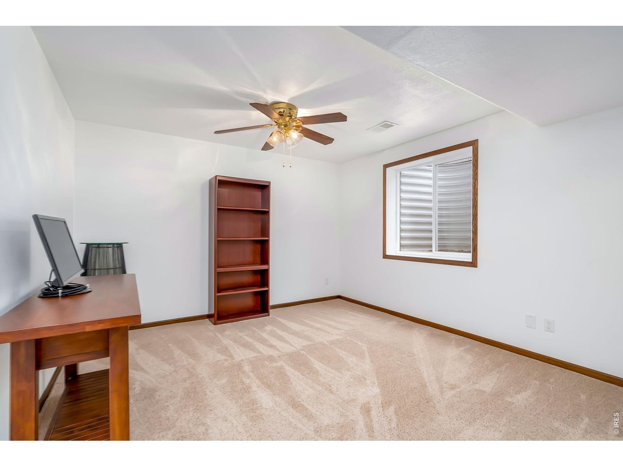 3779 Mount Meeker Street Wellington, CO 80549 - Photo 22 of 30 a workspace with furniture and window