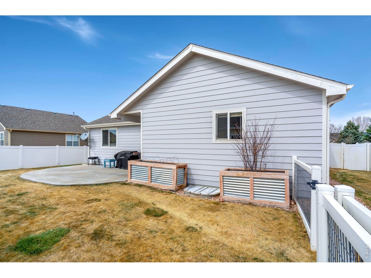 3779 Mount Meeker Street Wellington, CO 80549 - Photo 26 of 30 a view of a house with backyard and sitting area