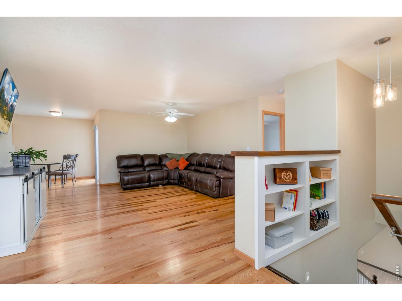 3779 Mount Meeker Street Wellington, CO 80549 - Photo 4 of 30 a living room with furniture and a wooden floor