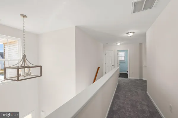a view of a hallway with closet