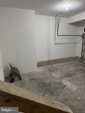 a view of a room with wooden floor and closet