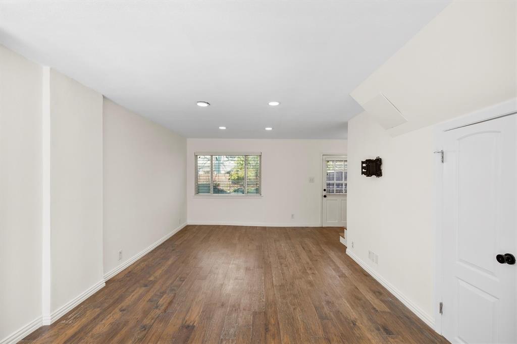 4039 Cole Avenue, Unit 105 Dallas, TX 75204 - Photo 15 of 39 Empty room with recessed lighting, visible vents, dark wood finished floors, and baseboards
