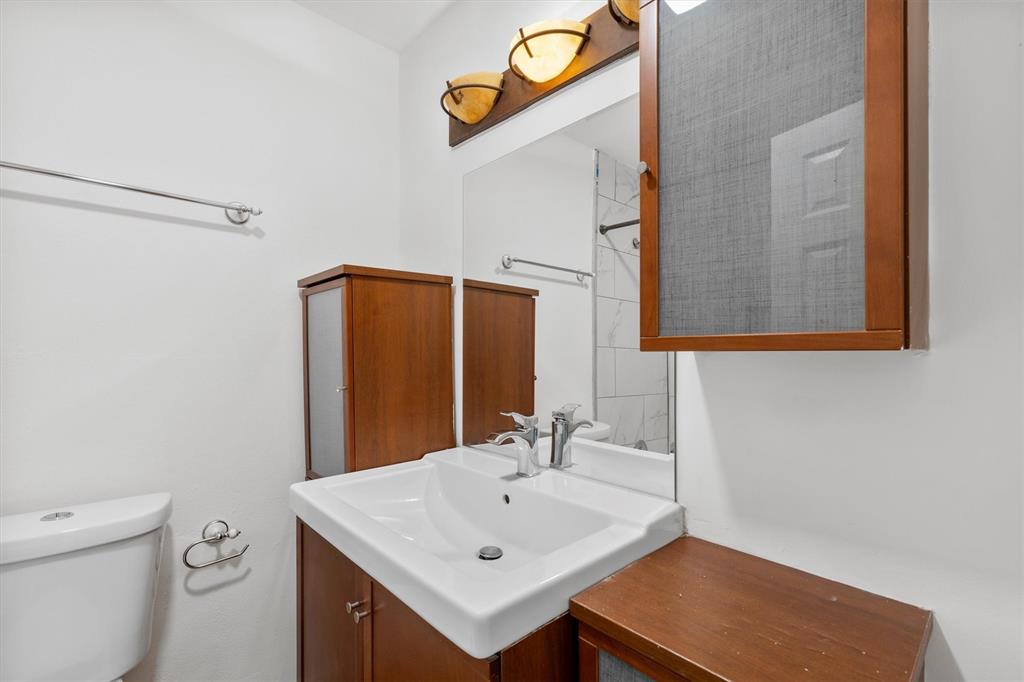 4039 Cole Avenue, Unit 105 Dallas, TX 75204 - Photo 26 of 39 Bathroom with vanity and toilet
