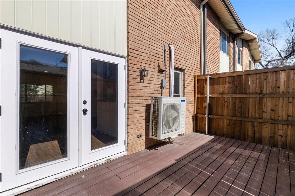 4039 Cole Avenue, Unit 105 Dallas, TX 75204 - Photo 29 of 39 Deck featuring ac unit and french doors