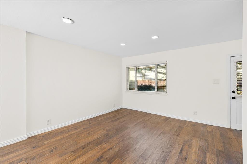 4039 Cole Avenue, Unit 105 Dallas, TX 75204 - Photo 7 of 39 Unfurnished room featuring recessed lighting, baseboards, and wood finished floors