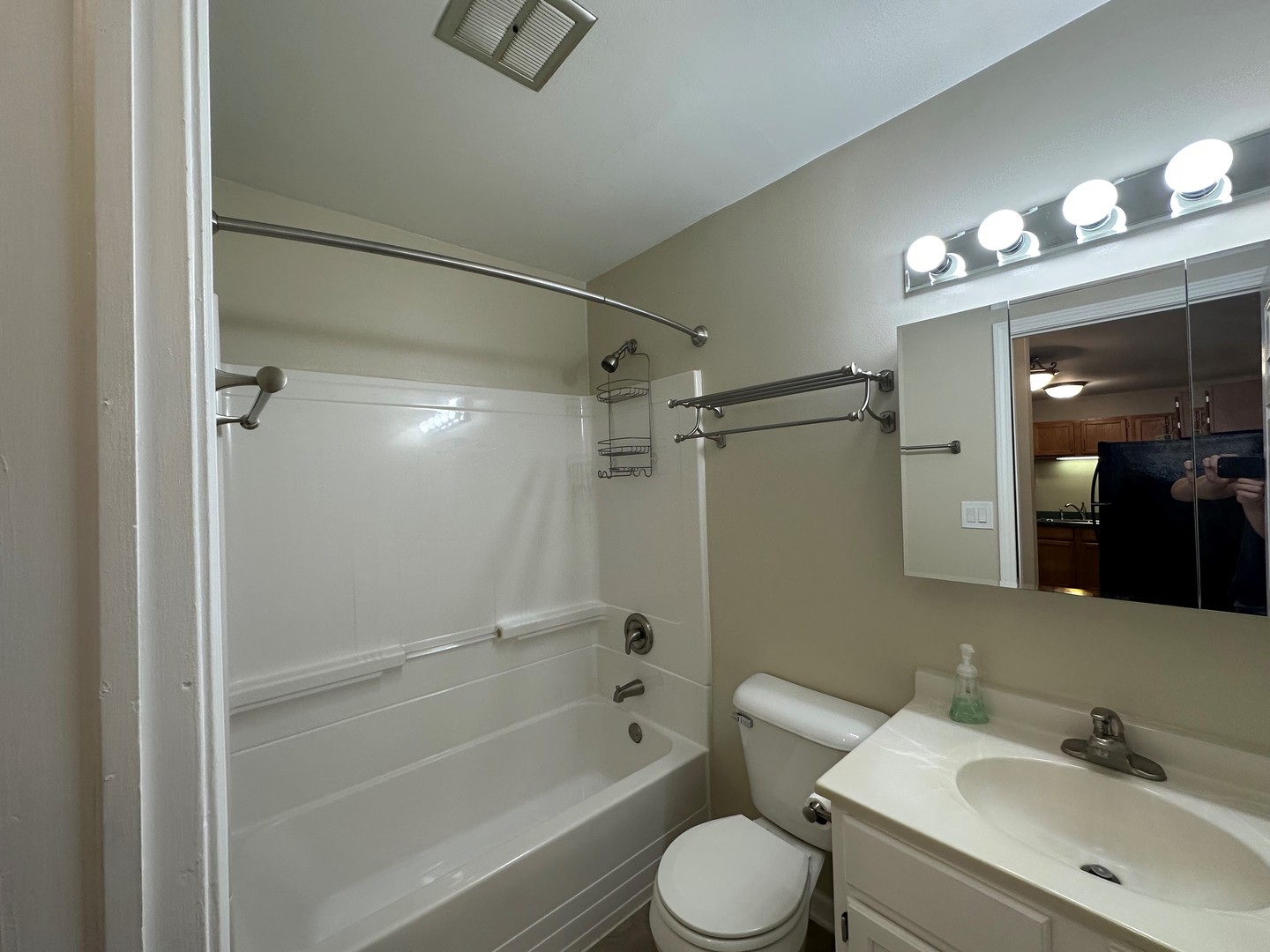 2100 Light Road, Unit 108 Oswego, IL 60543 - Photo 9 of 12 a bathroom with a sink a toilet and shower