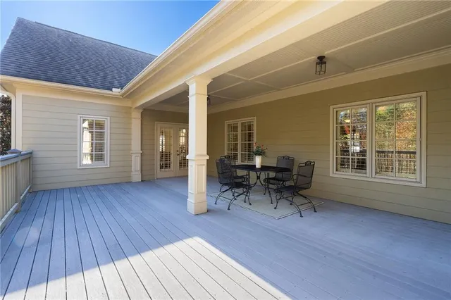 a dining room with furniture window and wooden floor