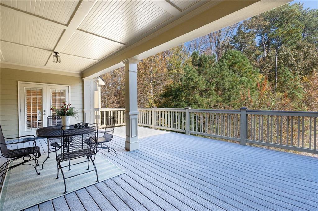 2472 Ballantrae Circle Cumming, GA 30041 - Photo 14 of 41 a view of a chairs and table on the wooden floor