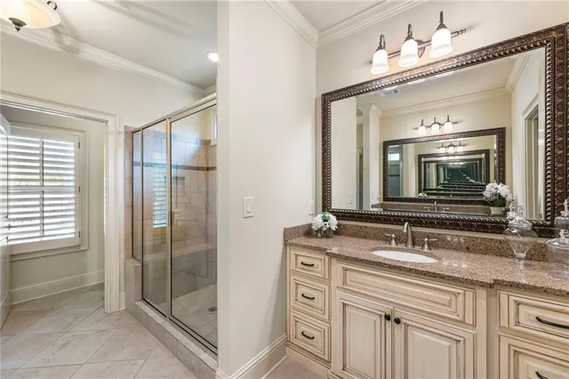 a bathroom with double sink and a mirror