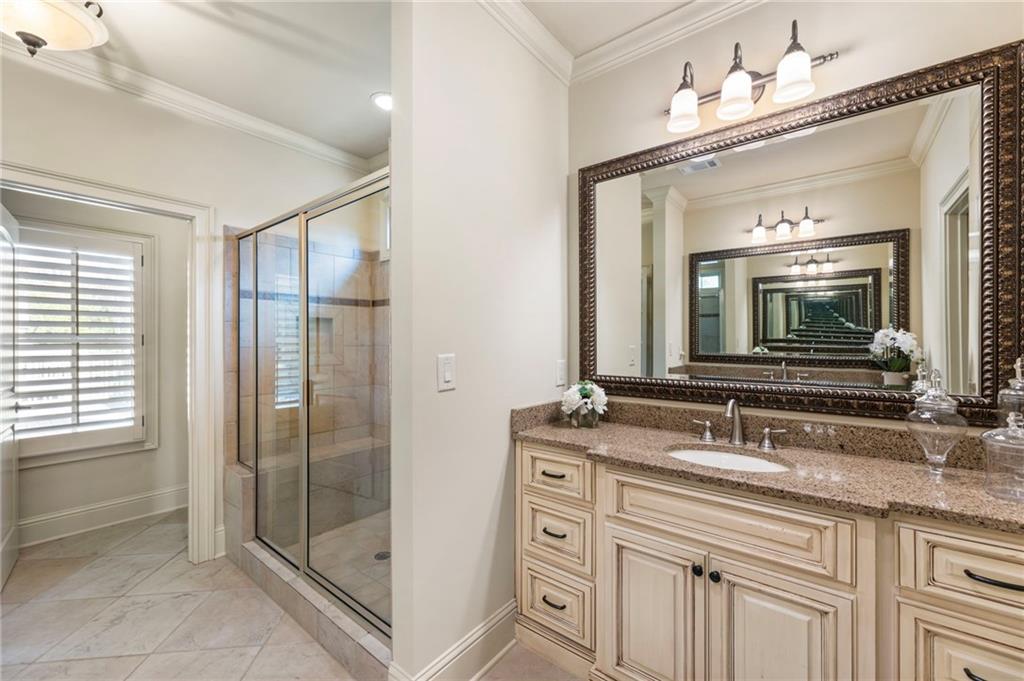 2472 Ballantrae Circle Cumming, GA 30041 - Photo 19 of 41 a bathroom with double sink and a mirror