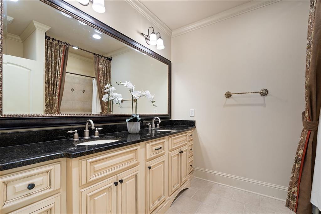 2472 Ballantrae Circle Cumming, GA 30041 - Photo 21 of 41 a bathroom with a sink and a mirror