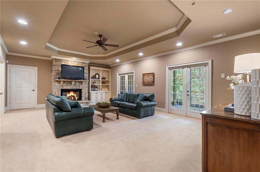 2472 Ballantrae Circle Cumming, GA 30041 - Photo 23 of 41 a living room with furniture and a fireplace